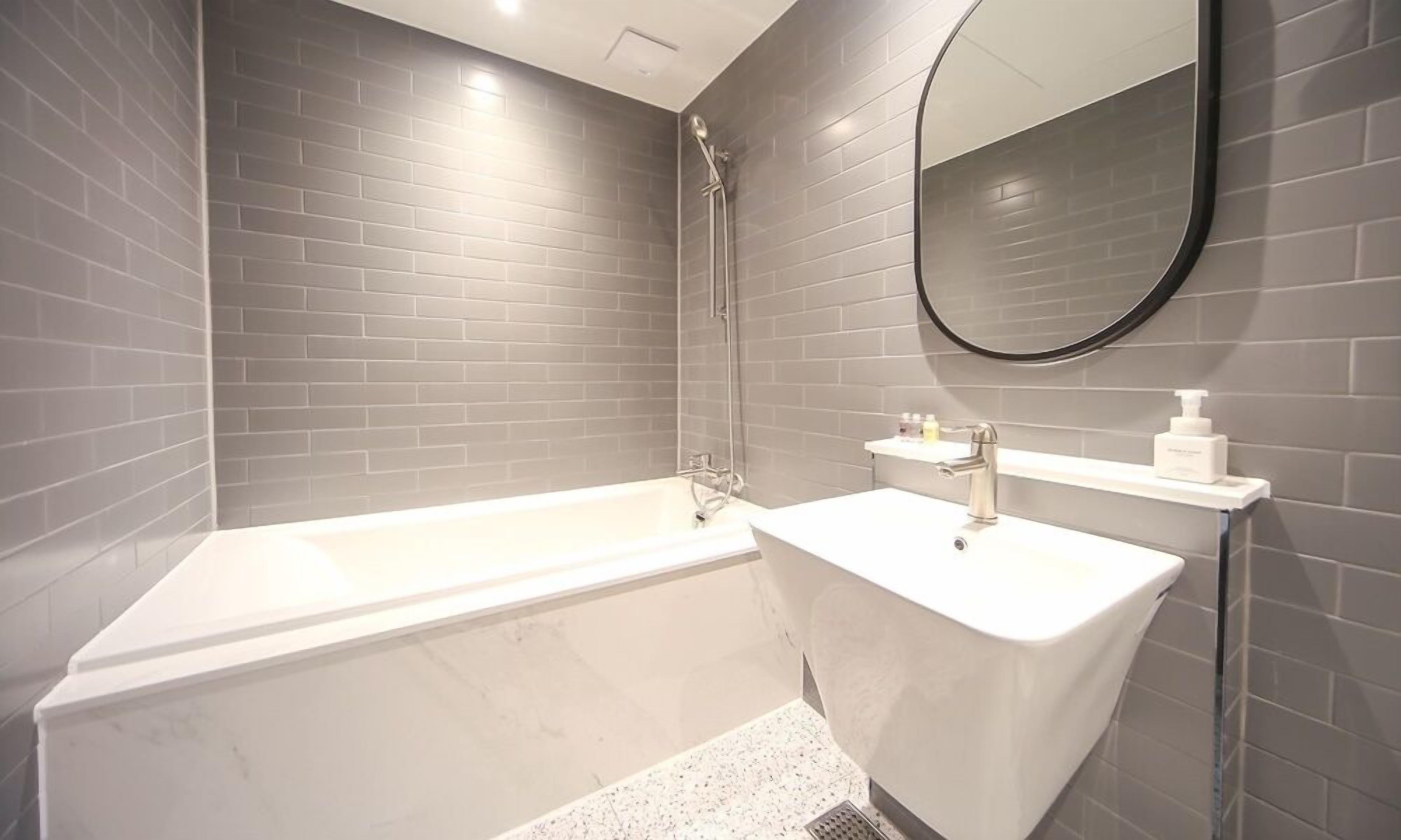 deluxe half ocean | bathroom | shower, hair dryer, bathrobes, slippers