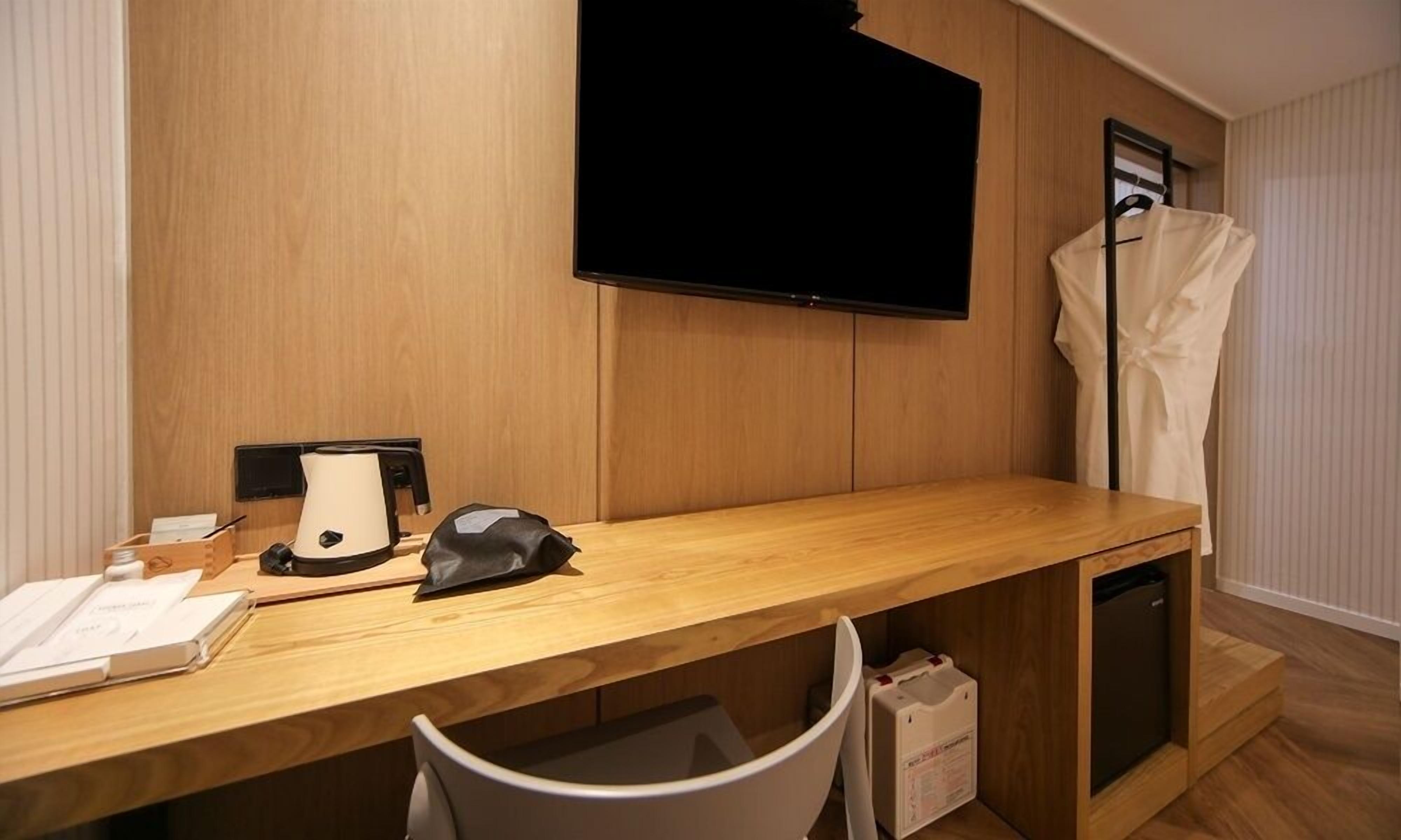 deluxe room | desk, laptop workspace, blackout curtains, soundproofing