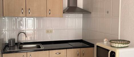 Fridge, microwave, stovetop, coffee/tea maker