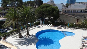 Seasonal outdoor pool, open 9:00 AM to 9:00 PM, pool umbrellas