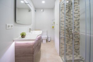 Combined shower/tub, hair dryer