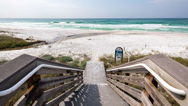 A wooden staircase leading to a beach with a sign in the background. - Ocean View Rooftop ☀️Heated Pool, 1 Minute to Beach, 4 Story Home ☀️ Beach Gear (Santa Rosa Beach)