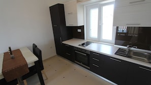 Fridge, oven, coffee/tea maker, cookware/dishes/utensils