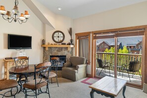 TV, fireplace, books