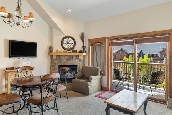 TV, fireplace, books