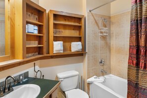 Combined shower/bathtub, hair dryer, towels, soap