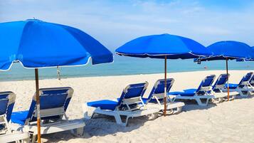 On the beach, sun loungers