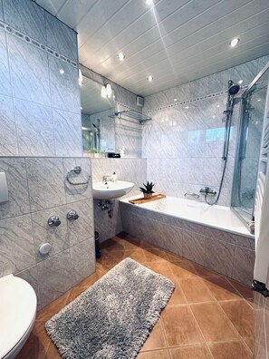 Bathtub, hair dryer, towels