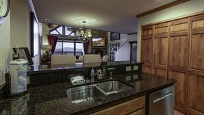 A kitchen with granite countertops, stainless steel appliances, and wooden cabinets. - 'Elevation Station' at 5100 ft w/ Panormic Views (Sugar Mountain)