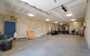 Exposed ductwork and unfinished surfaces characterize this basement area.