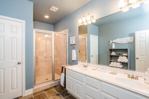 Combined shower/bathtub, towels, soap, toilet paper
