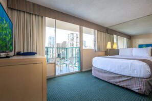 A hotel room with a bed, a desk, a chair, a balcony with a view of the city, and a painting on the wall. - Aqua Aloha Surf Waikiki 1512 | Sparkling City Views – Pool & BBQ (Honolulu)