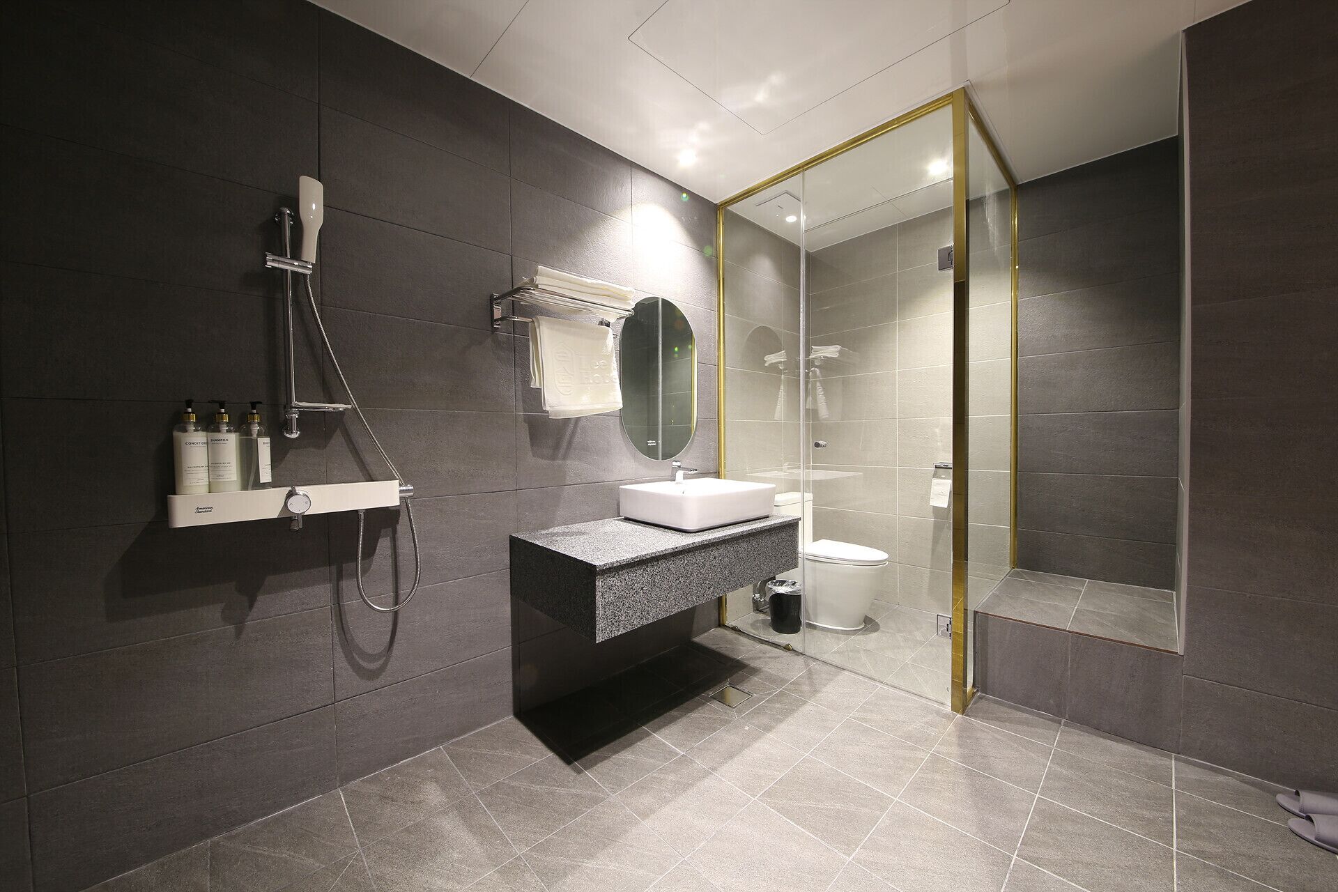 deluxe family twin room (only family can share rooms of more than two) | bathroom | free toiletries, hair dryer, bathrobes, slippers