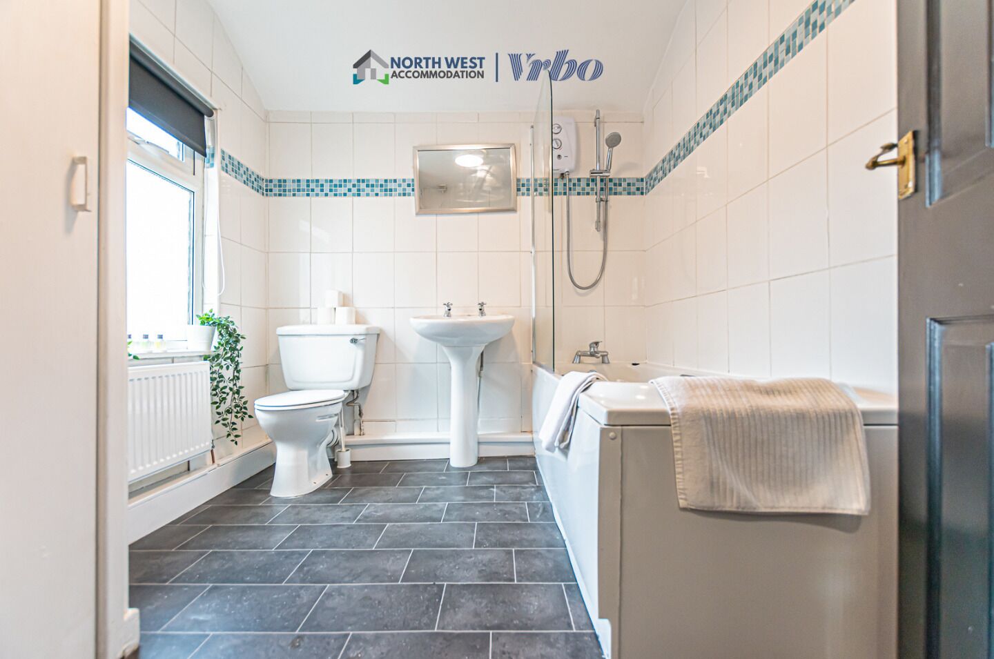 Combined shower/bathtub, hair dryer, towels, soap
