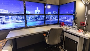 A modern office with multiple monitors displaying a cityscape at night. - HALE Kyoto Tambaguchi (Kyoto)