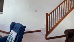 A spacious room with a high ceiling, a wooden staircase, and a ceiling fan. - On the river close to all adventure and short drive to Durango (D&S Train/Mesa Verde/Million Dollar HWY) (Bayfield)