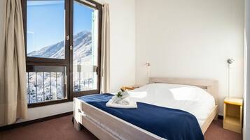 2 slaapkamers, een strijkplank/strijkijzer, beddengoed