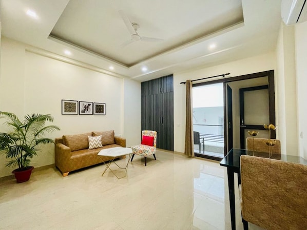 Standard Apartment, 1 Bedroom | Living area | 180-cm LED TV with satellite channels, TV, fireplace