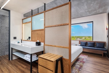 Shower, rainfall showerhead, designer toiletries, hair dryer at Aloft Tulum