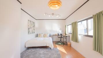 Desk, laptop workspace, blackout curtains, free WiFi