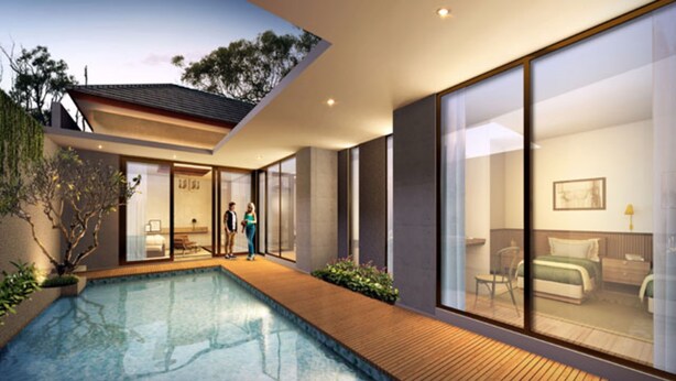 Un hotel moderno con piscina, amplios ventanales y una decoración interior minimalista.