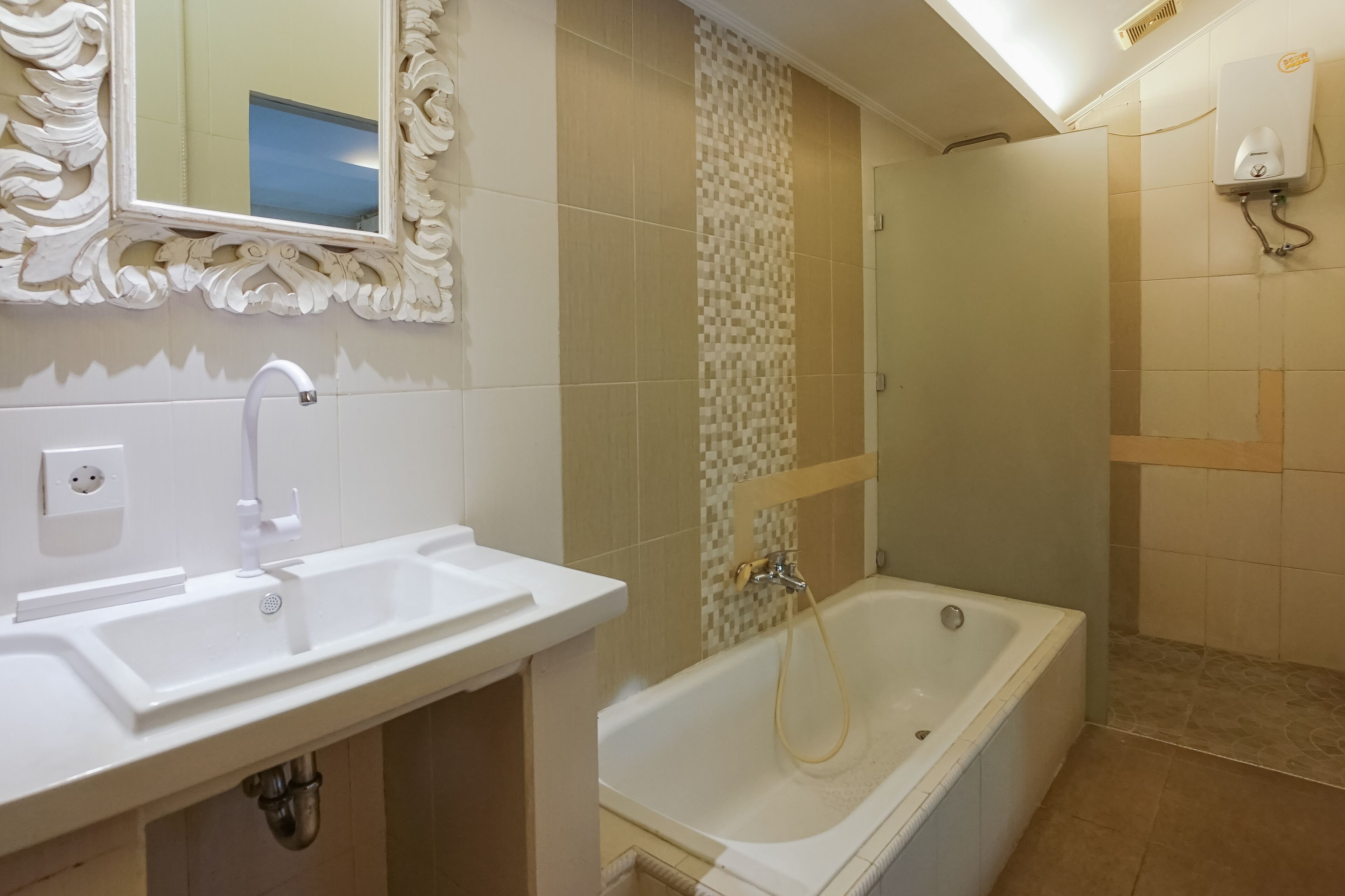 A bathroom with a white sink, a bathtub, and a shower.