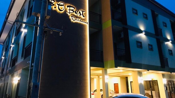 A multi-story building with a sign reading "Best Residence". - B.O Best Residence (Phang Nga)