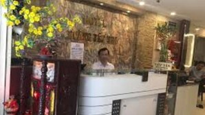 A reception desk with a sign that reads "Welcome to the Hotel." - Hoang Yen Nhi Hotel (Ho Chi Minh City)