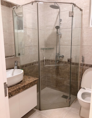 Studio Room | Bathroom | Shower, rainfall showerhead, slippers, towels - Spring Gardens Apartment (Ho Chi Minh City)