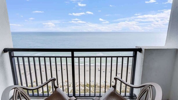 A balcony with a view of the beach and ocean. - Oceanfront,Heated Pools,Views New, Penthouse Level (Myrtle Beach)