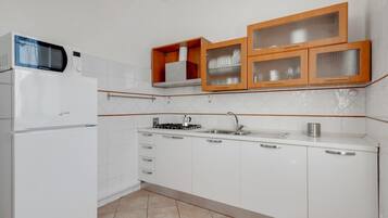 Appartamento, 1 camera da letto | Cucina privata | Frigorifero con congelatore, microonde, forno, piano cottura