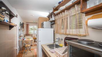 Studio (Studio Apartment with Private Beach a) | Private kitchenette | Fridge