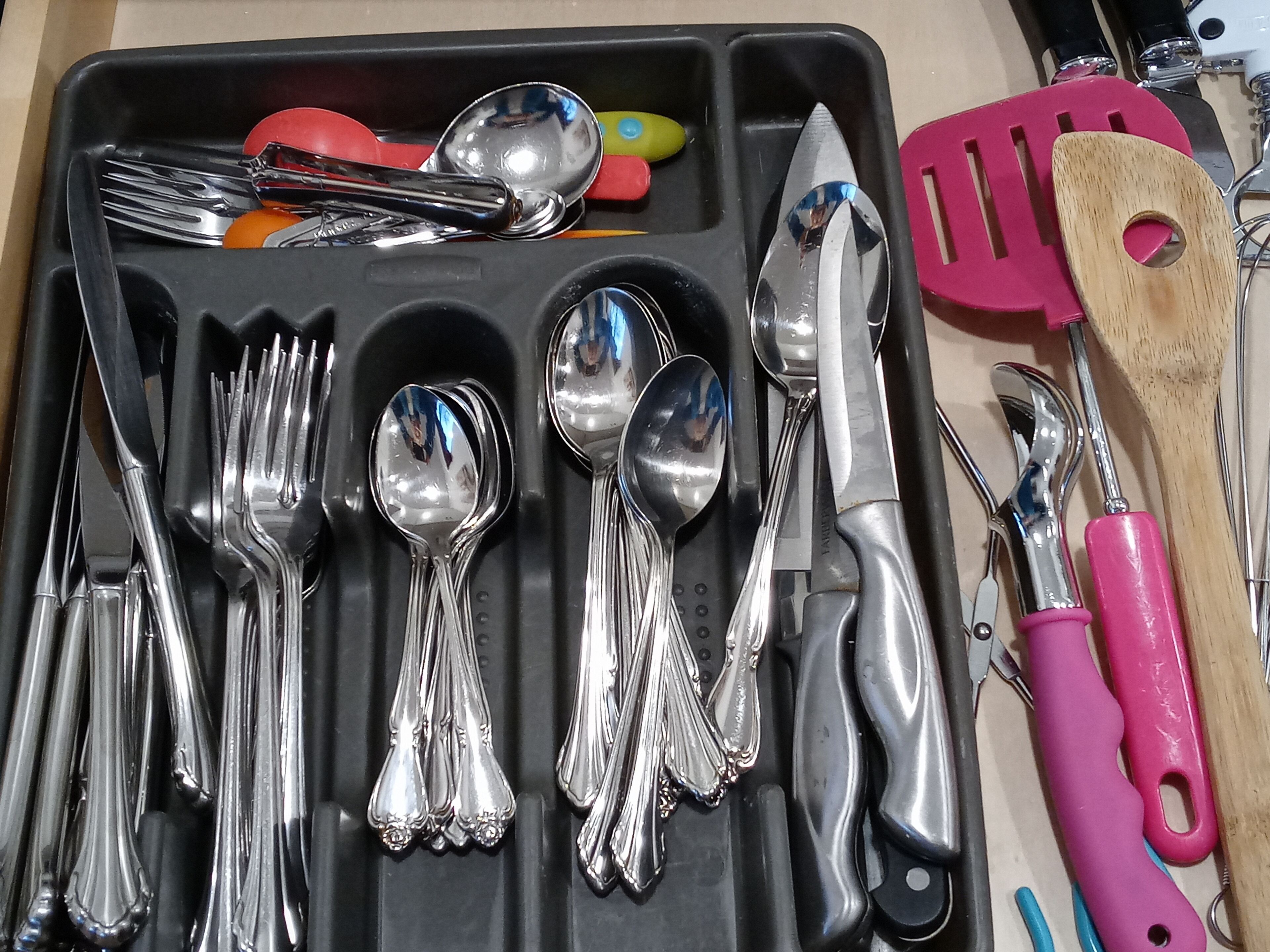 Silverware, baby spoons, and other kitchen utensils.