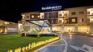 A modern hotel entrance with a sign reading "Residence Inn by Marriott" and a well-lit driveway. - Residence Inn by Marriott Cancun Hotel Zone (Cancun)