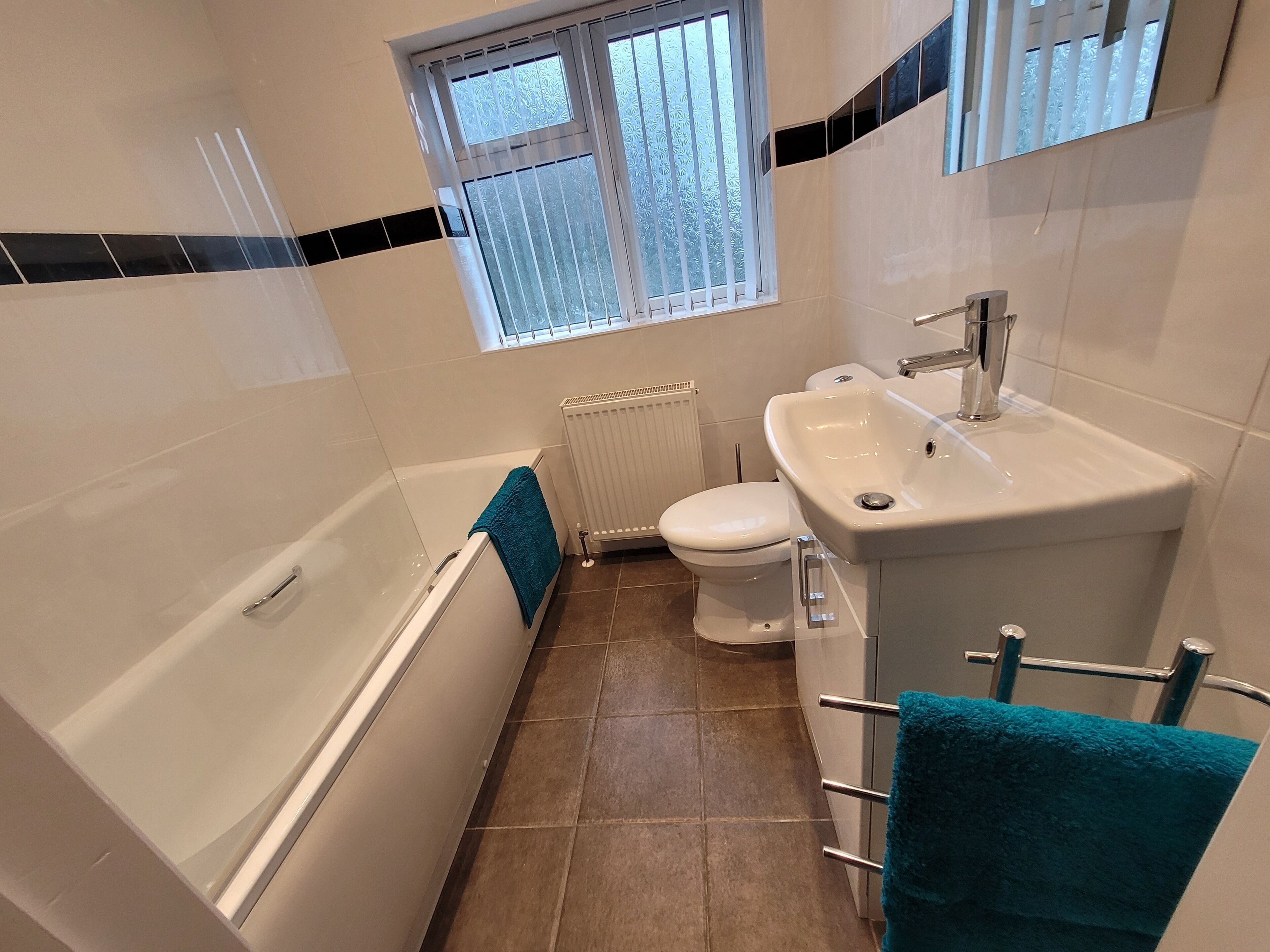 Combined shower/tub, hair dryer, towels, toilet paper
