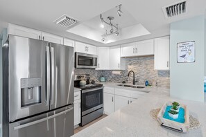 Fridge, microwave, oven, stovetop - 🐾 Pet Friendly, Heated Pool, Gorgeous Renovation, Walk to the sugar sand of FMB! (Fort Myers Beach)