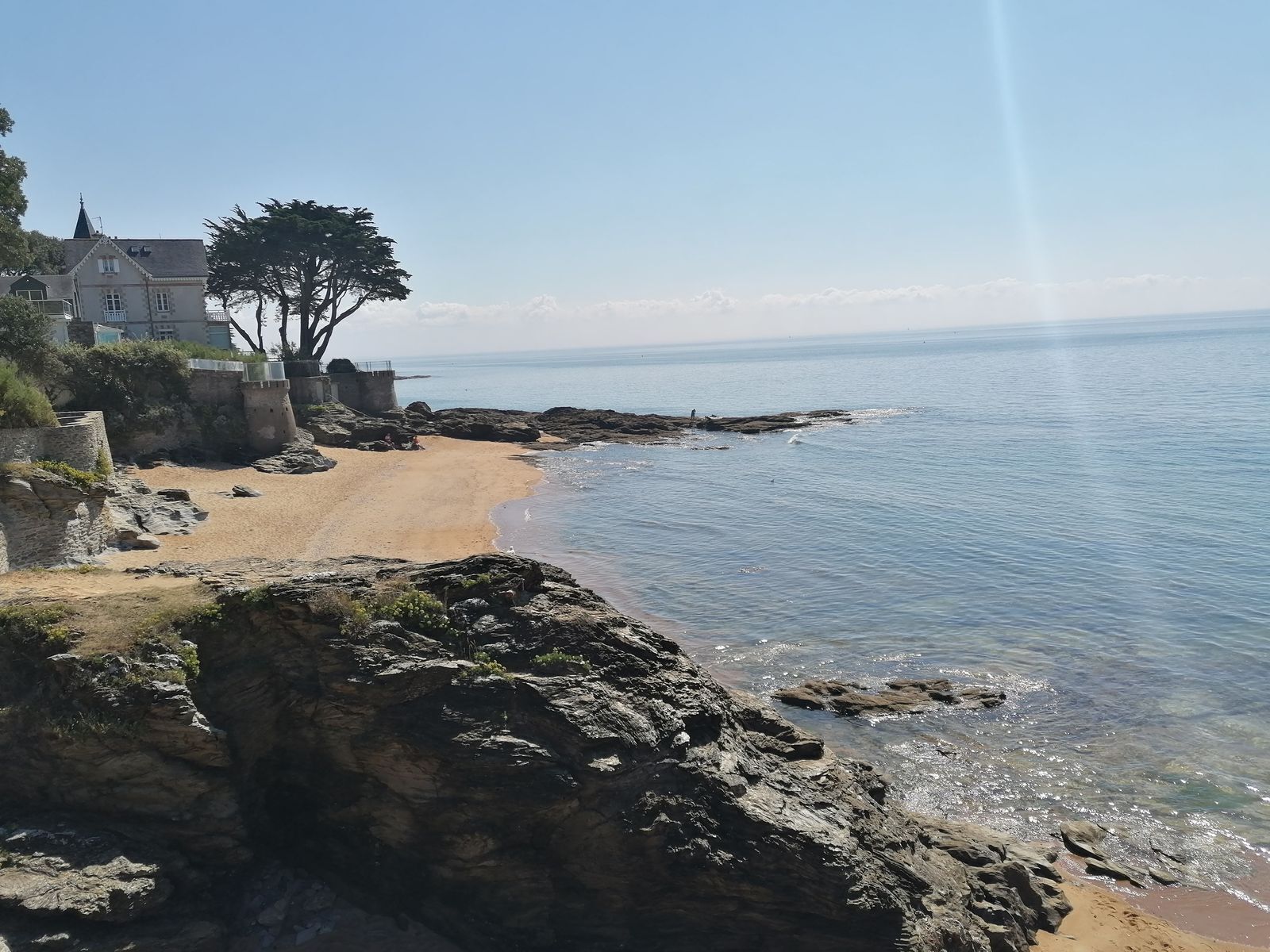 On the beach, sun-loungers