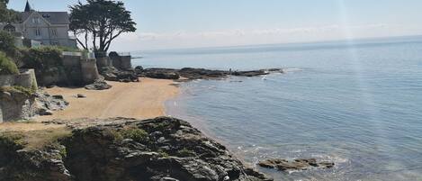 On the beach, sun-loungers