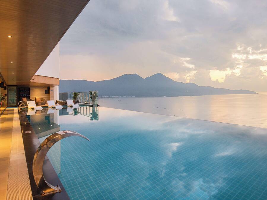 Outdoor pool, open 6:00 AM to 9:00 PM, pool loungers