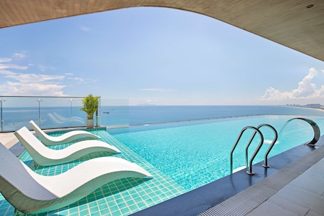 Outdoor pool, open 6:00 AM to 9:00 PM, sun loungers