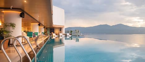 Outdoor pool, open 6:00 AM to 9:00 PM, sun loungers