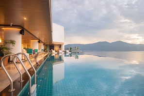 Outdoor pool, open 6:00 AM to 9:00 PM, sun loungers