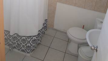 Shower, towels, soap, toilet paper