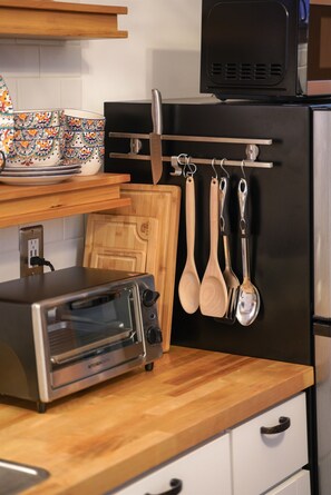 Fridge, microwave, stovetop, coffee/tea maker