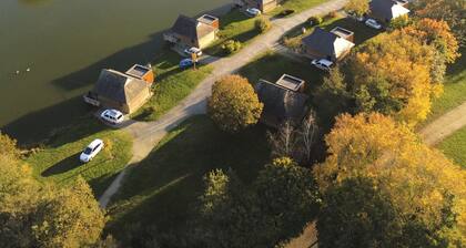 "Charming Lakeside Chalet with Private Fishing Pier, Game Room, and Nearby Village Amenities"