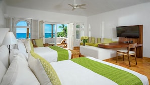 A hotel room with two beds, a desk, a TV, and a view of the ocean. - 4 BR Cas Lita Includes A/C, WiFi, Private Pool and Much More! (Palmilla)