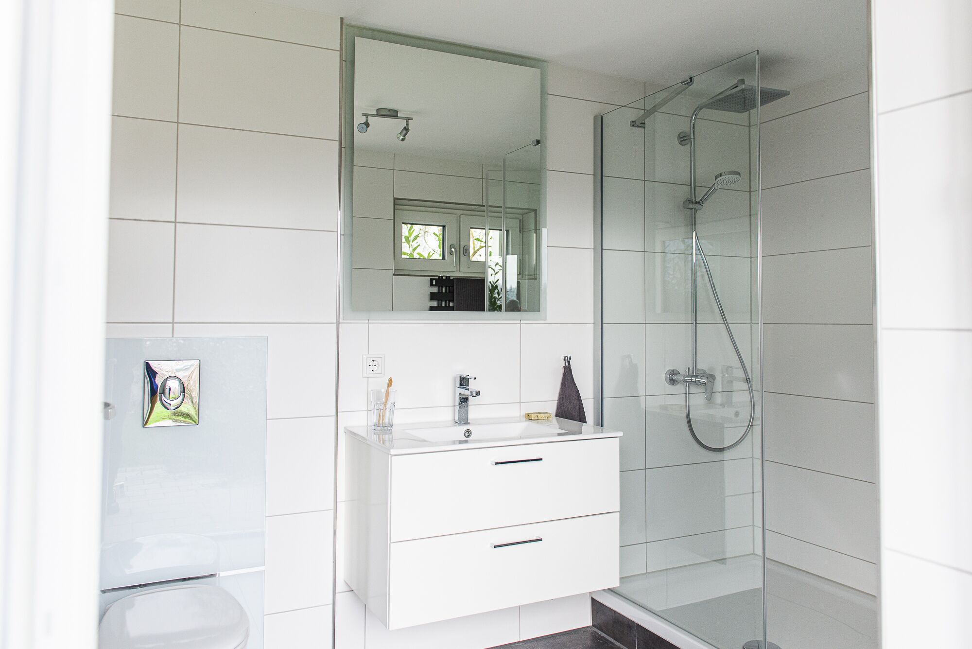 Shower, hair dryer, slippers, towels