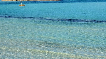 On the beach, sun loungers, beach towels