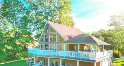 Lakehouse with covered dock, slide, and outdoor kitchen! Close to I-75, trails.