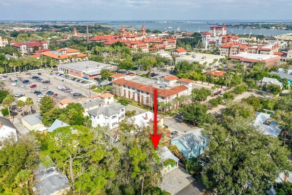 An aerial view of a coastal town with historic buildings, a marina, and a parking area. - Citrus Hideaway l Hot Tub l 1 Block to Downtown (St. Augustine)